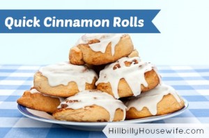 A plate of delicious cinnamon rolls coated with sugary frosting glaze.