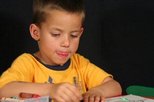 Kid busy coloring in