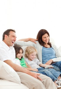 Happy family watching a movie together