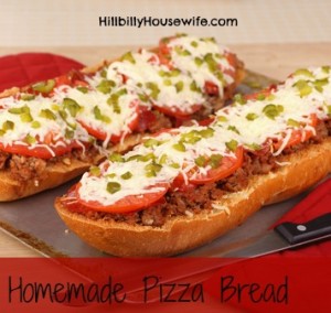 French bread pizza with hamburger pepperoni tomato and melted cheese