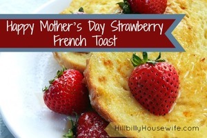 French toast topped with strawberries, maple syrup and powdered sugar.