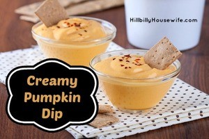 Pumpkin dip in small glass cups with bread crisps 