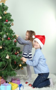 Kids decorating Christmas tree 