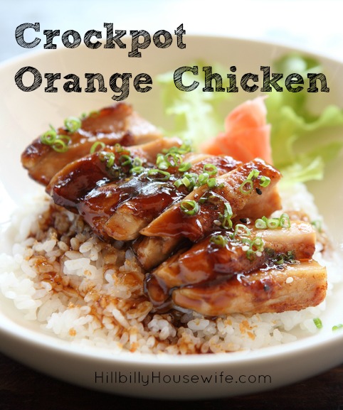 A Bowl of Orange Chicken served over hot rice. 