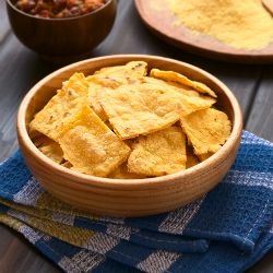 Bowl of homemade corn chips - so quick and easy to make from corn tortillas. Just cut and bake