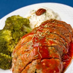 Plate of homemade meatloaf and sides.