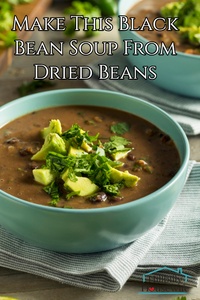 Black bean soup made from dried beans topped with avocado