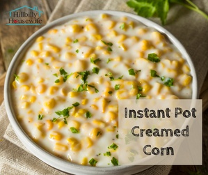 A bowl of creamed corn cooked in the Instant pot with butter and cream cheese, garnished with parsley.