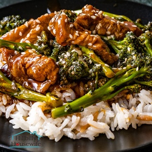A dish of beef and broccoli made with frozen broccoli over rice. 